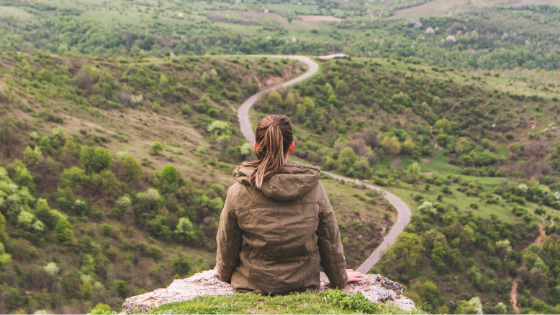 A Traveler Making A Decision At A Crossroads