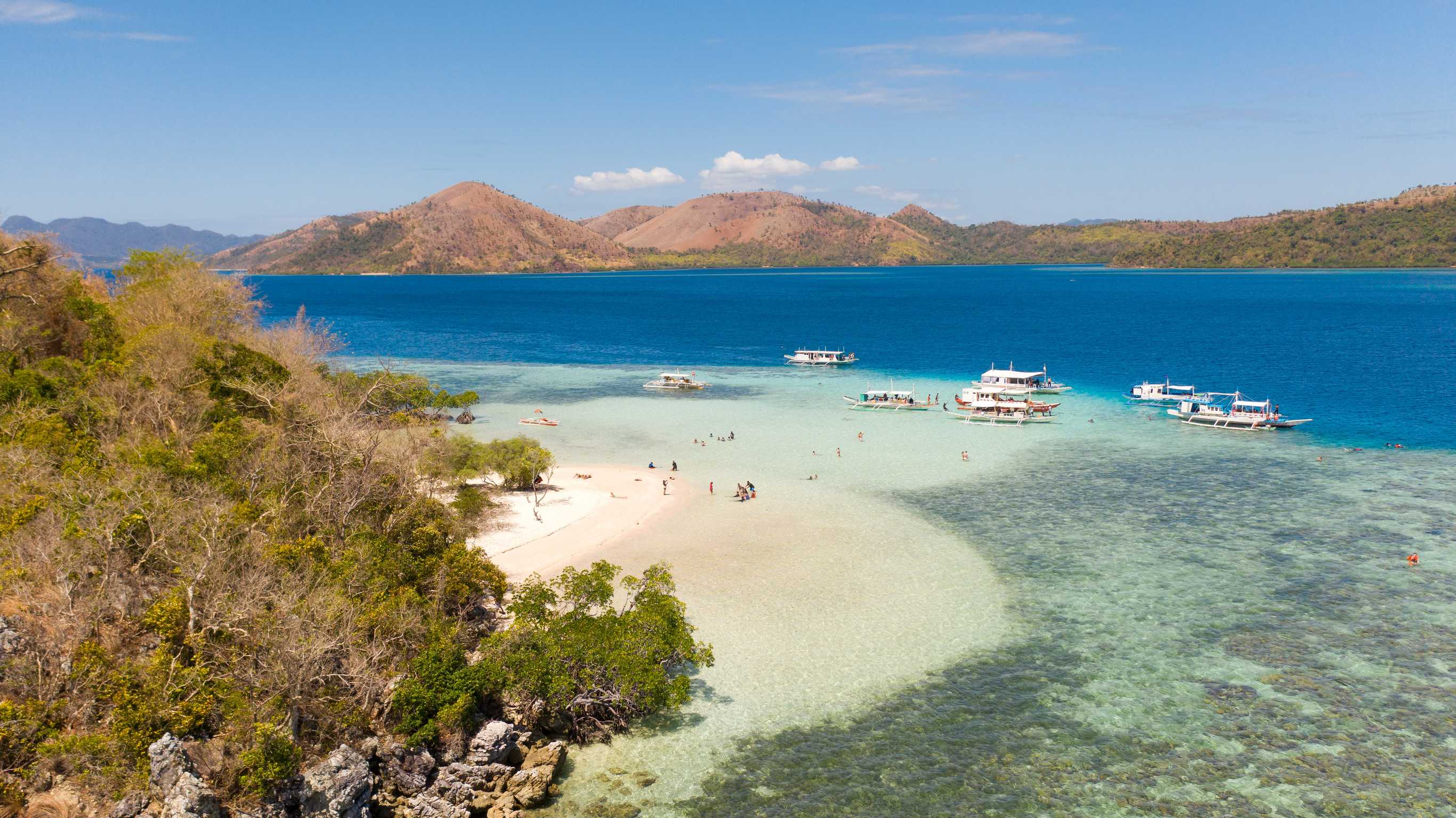 Beautiful Lagoon With A White Beach Philippine Islands Boat