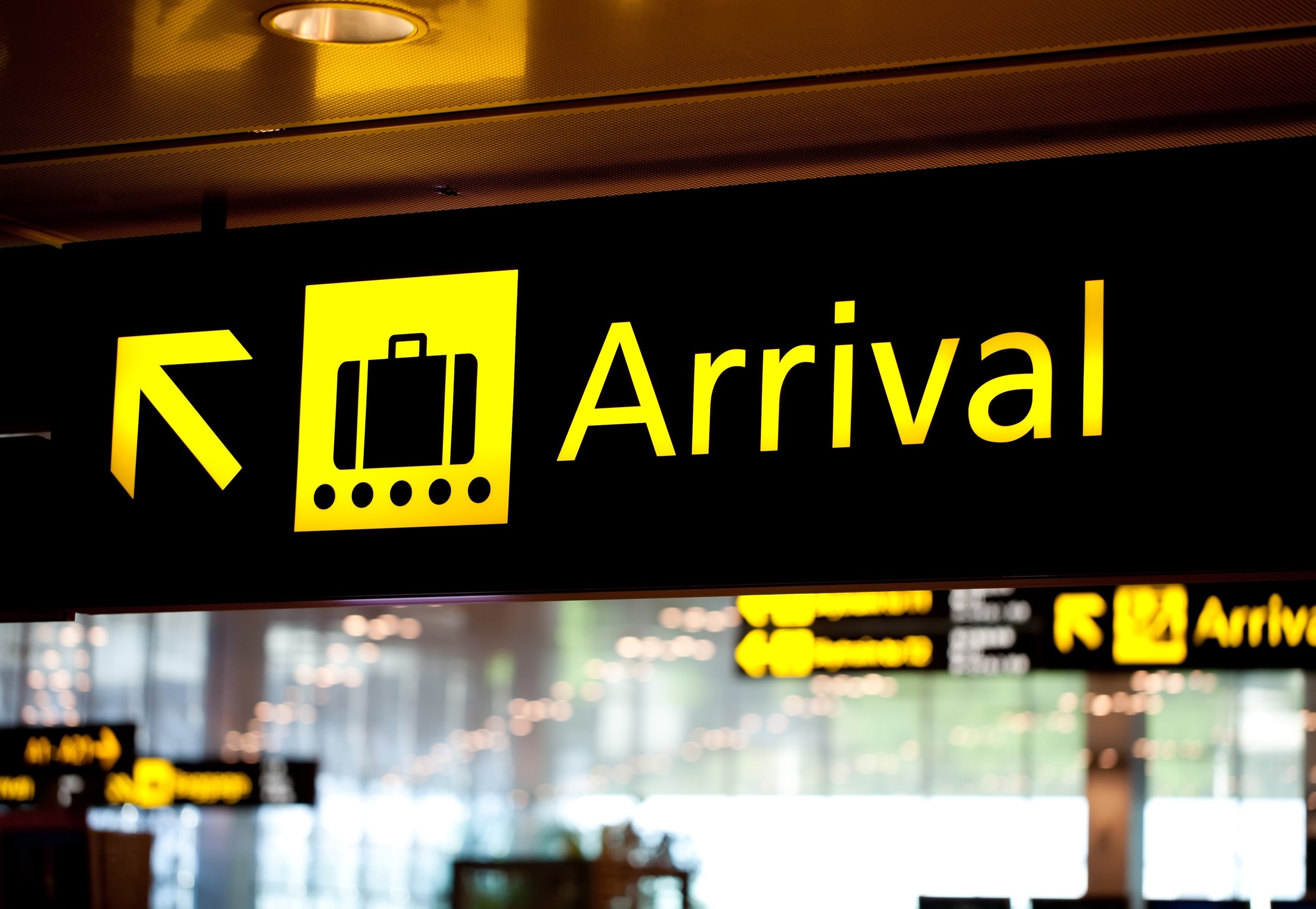 Brightly light arrival airport information sign