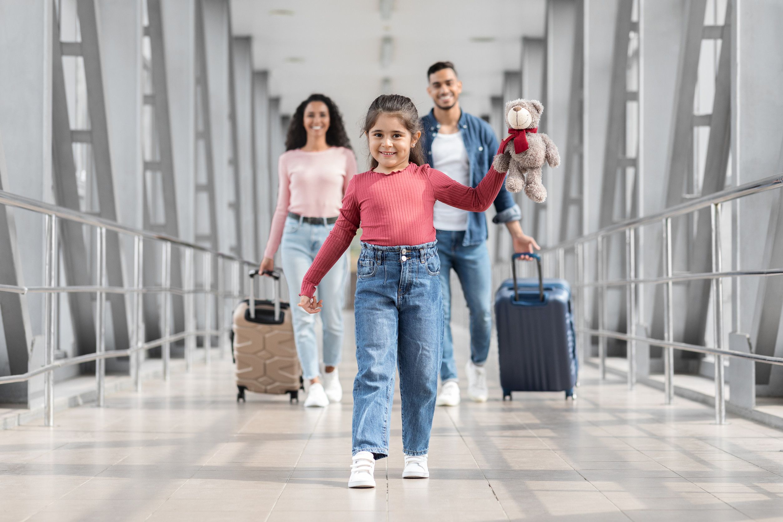 Happy girl walking at airport