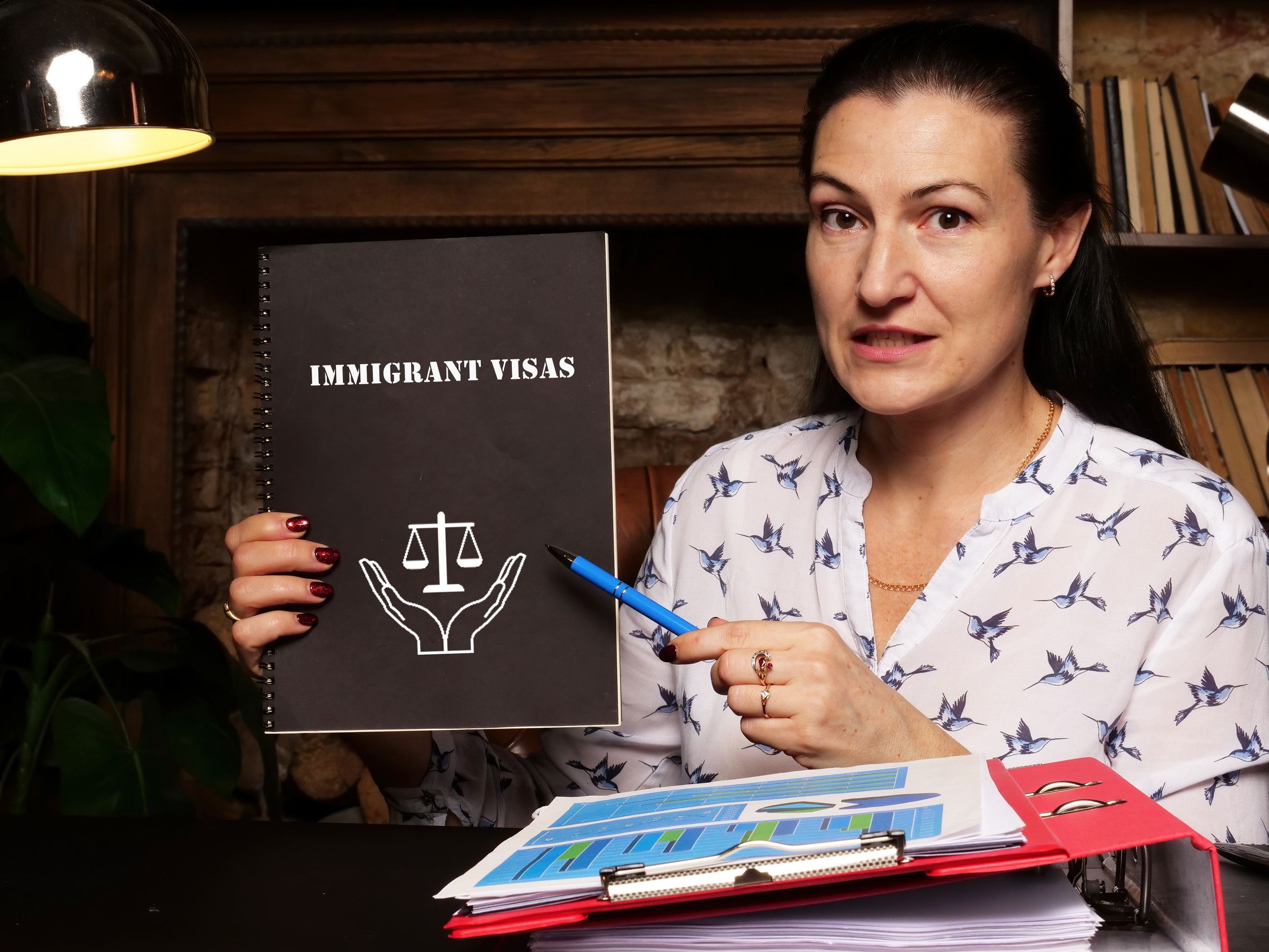 Juridical concept about immigrant visas with inscription on the sheet