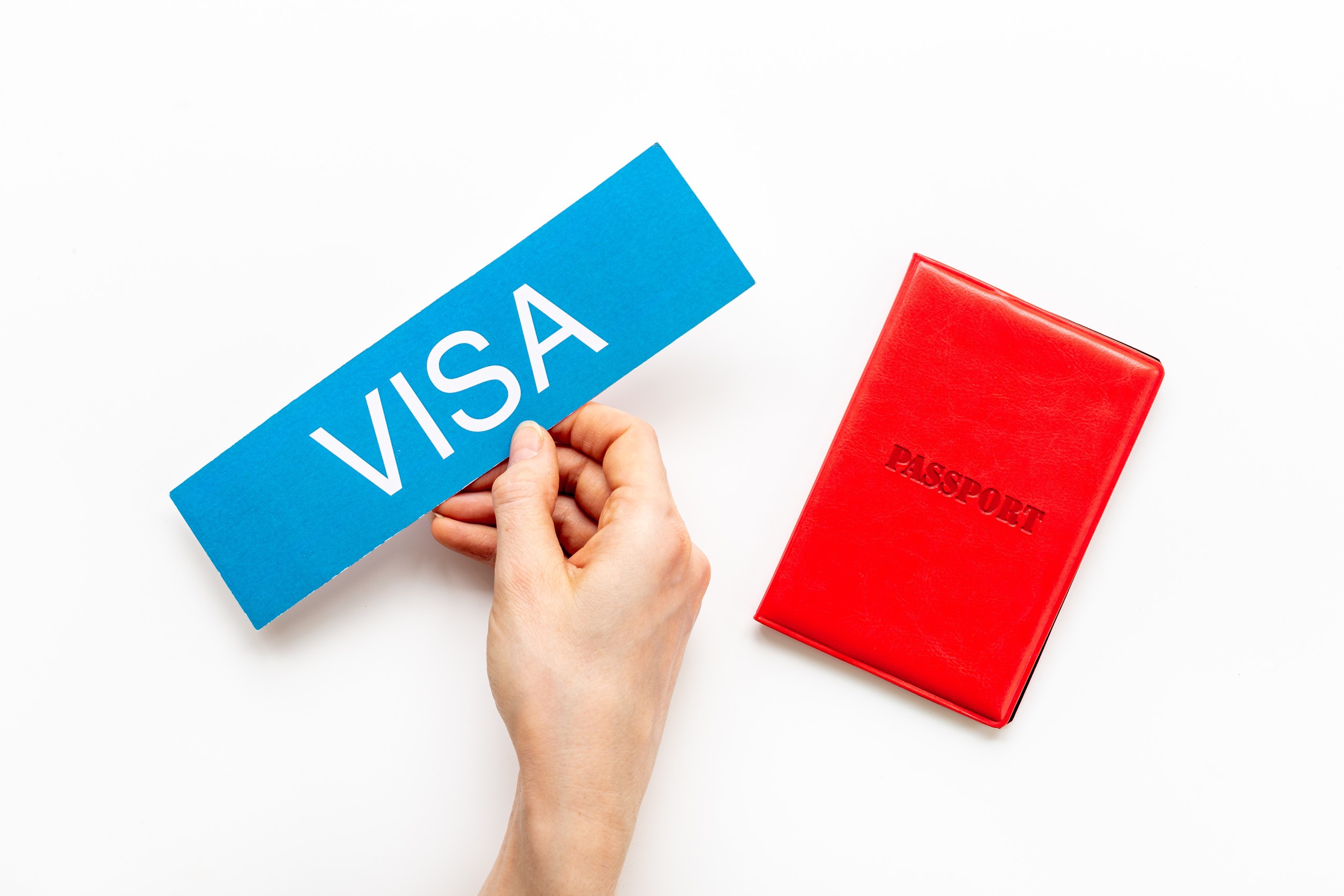 Red passport with approved visa vacation trip concept
